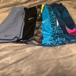 2 Nike athletic shorts lg,Nike swim lg,Nike drifit med,boys excellent condition.